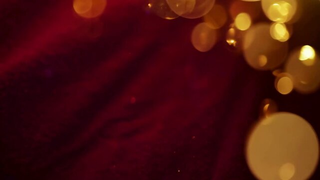 Warm, dark crimson red background with large golden bokeh lights slowly fading. Great as a moody overlay or festive background for luxury themes.