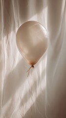 Elegant Light Balloon Floating Against Soft White Curtain Background