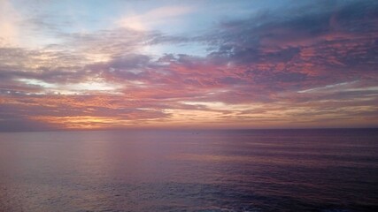 Vibrant Pink and Purple Sunset Over Wild Atlantic Ocean Coastline