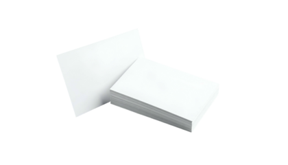 Stack of blank rectangular white cards leaning against a single upright card on black backdrop