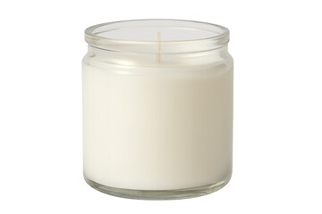 Unlit white wax candle in glass jar