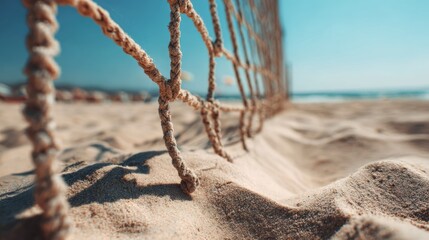 Beach Volleyball Net on Sand with Clear Blue Sky and Ocean View