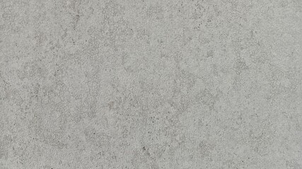 Close-up of a bright, light gray, uniform concrete wall or plaster texture for backgrounds.
