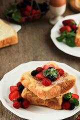 Close Up French Toasts with Strawberry, Blackberry, and Raspberry.