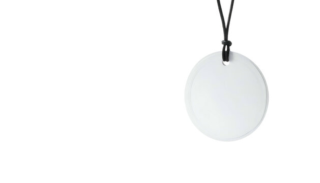 White circular pendant on a black cord, isolated on a black background