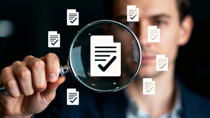 Man examining document icon through magnifying glass with floating checkmark documents