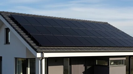 Modern black solar panels mounted on a roof for sustainable energy solutions - Powered by Adobe