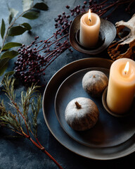 Minimalist Halloween spooky flat lay with candles, pumpkins, and foliage creates inviting atmosphere. Perfect for seasonal decor