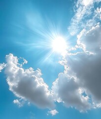 Bright sun shining through scattered fluffy white clouds in a clear blue sky on a sunny day