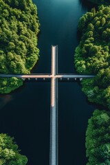 Aerial view of a cross-shaped pedestrian bridge over dark river water surrounded by dense green forest trees on both sides