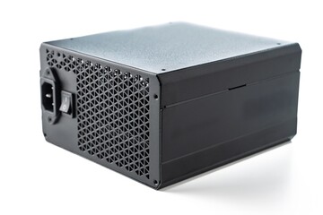 Isolated on white background, a sleek black power supply unit designed for computer systems. Ideal for tech articles, product reviews, and DIY PC projects. A high-quality component for builders.