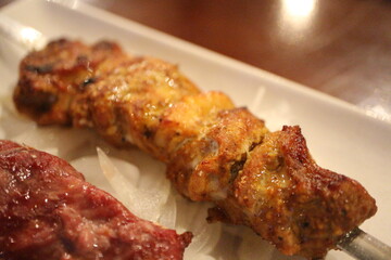 Afghan cuisine: mutton kabob and murgh (Afghan chicken)