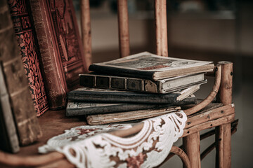 Old paper books are on a vintage bookcase