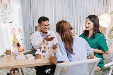 Fototapeta premium Team of doctors and nurses collaborating in a clinical environment, reviewing treatment options and sharing medical opinions to provide effective patient-centered healthcare solutions.