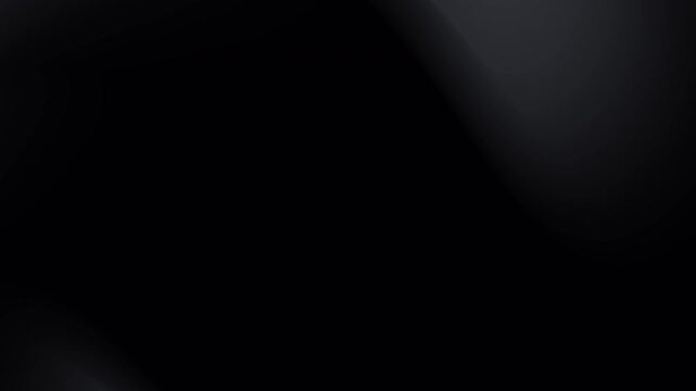 Blurred black and gray gradient background suitable for abstract design projects, website backgrounds, and artistic overlays in various creative works.