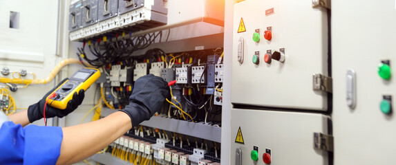 Electricity and electrical maintenance service. Engineer checking electric on circuit breaker and...