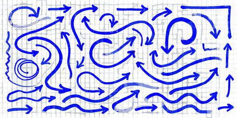 Collection of hand drawn blue arrows and symbols on a grid background