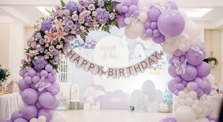 Festive floral arch with lavender balloons and "Happy Birthday" banner