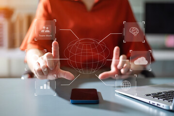 Businesswoman uses a tablet to analyze data on a virtual interface, symbolizing business innovation, technology, and global connection