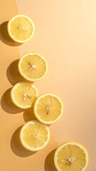 Lemon slices arranged on a two-tone background