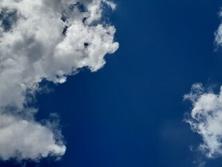 Clear Blue Sky with Fluffy White Cumulus Clouds