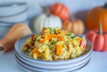home made Pumpkin risotto on a rustic table