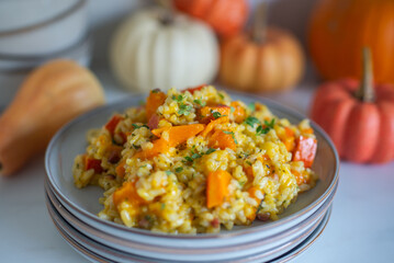 home made Pumpkin risotto on a rustic table