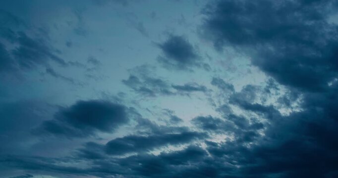 Colorful Evening Clouds Timelapse &ndash; Sunset sky glows with vibrant textures as clouds drift across horizon.