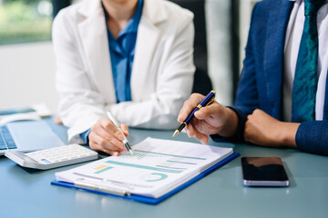 Team business meeting presentation. Hand businessman working project in modern office.Laptop computer and tablet and smart phone on white desk