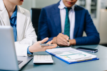Team business meeting presentation. Hand businessman working project in modern office.Laptop computer and tablet and smart phone on white desk