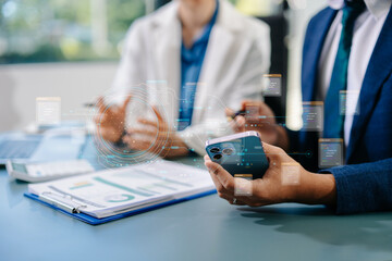 Business professionals using smartphone and holographic AI data interface to analyze digital information and innovate in office.