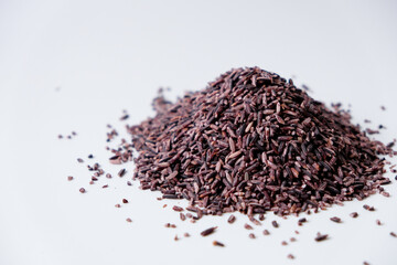 Black sticky rice grains isolated on white background
