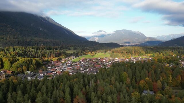 Aerial view of the colorful autumn scenery around the small town of Grainau in Bavaria with the peak of Wank in the Ester mountain range in the background