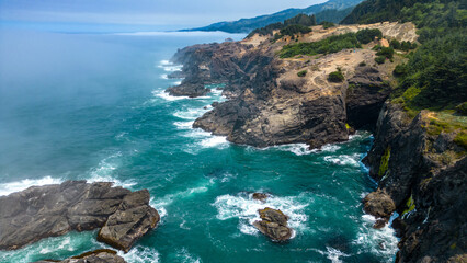 Fototapeta premium Aerial photo of Oregon rocky coast along Samuel H Boardman sceni corridor