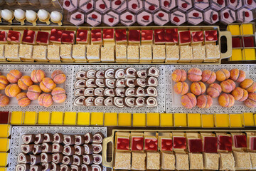 Upclose top to down photos of various sweets at a wedding banquet table