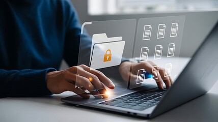 Hands typing on laptop organizing digital files and data management concept