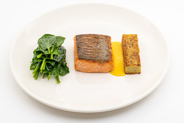 Seared salmon fillet served with wilted spinach and potato croquette