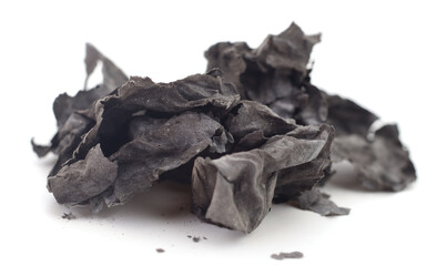 Burnt paper ash isolated on white background