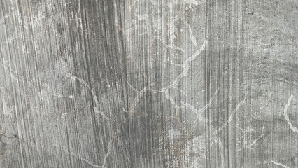 Fine vertical lines characterize this grungy gray concrete texture, perfect for modern minimalist backgrounds.
