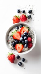 A beautiful bowl of oatmeal topped with fresh strawberries, blueberries, raspberries, and chia seeds.  Perfect for a healthy breakfast.