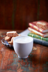 Cappuccino on dark wooden background. Soft focus. Close up	