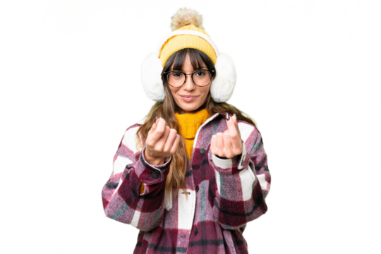Young caucasian woman wearing winter muffs over isolated chroma key background making money gesture
