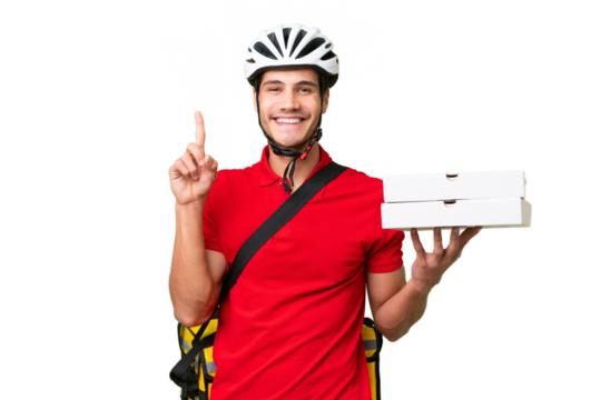 Pizza delivery man with work uniform picking up pizza boxes over isolated background pointing up a great idea