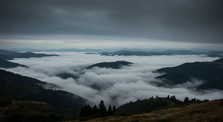 Misty Mountain Landscape with Low-Lying Clouds at Dawn