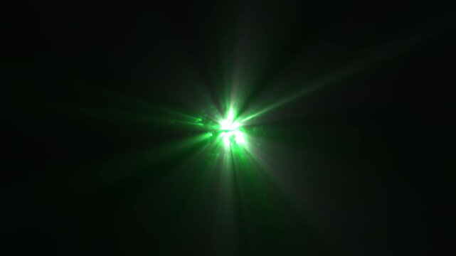 Green Glowing Energy Orb Emitting Moving Light Rays From Central Point from Darkness. Abstract Energy Flares Shining on Black Background. UFO Alien Style Effect.