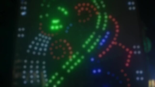 Abstract light pattern captured with intentional blur, showing colorful circular lights creating a dreamy, festive aesthetic.
