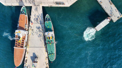 Aerial drone view of the passenger ferries at pier at Bosphorus , Istanbul city lines water transportation, passenger transport ferryboat, Istanbul, Turkey