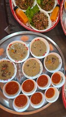 Traditional Asian Cuisine with Varieties of Dishes Served in Bowls on a Decorative Tray