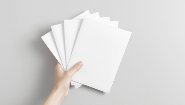 Transparent hand holding a stack of blank white paper sheets or magazines against a neutral gray background, perfect for mockups and design concepts mockup  - Powered by Adobe