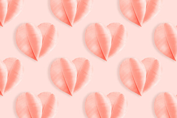 Pink hearts from fluffy feathers on pastel peach background. Minimal aesthetic pattern, symbol of love and romance, holiday greetings for Valentine Day, pink monochrome flat lay photo, top view layout